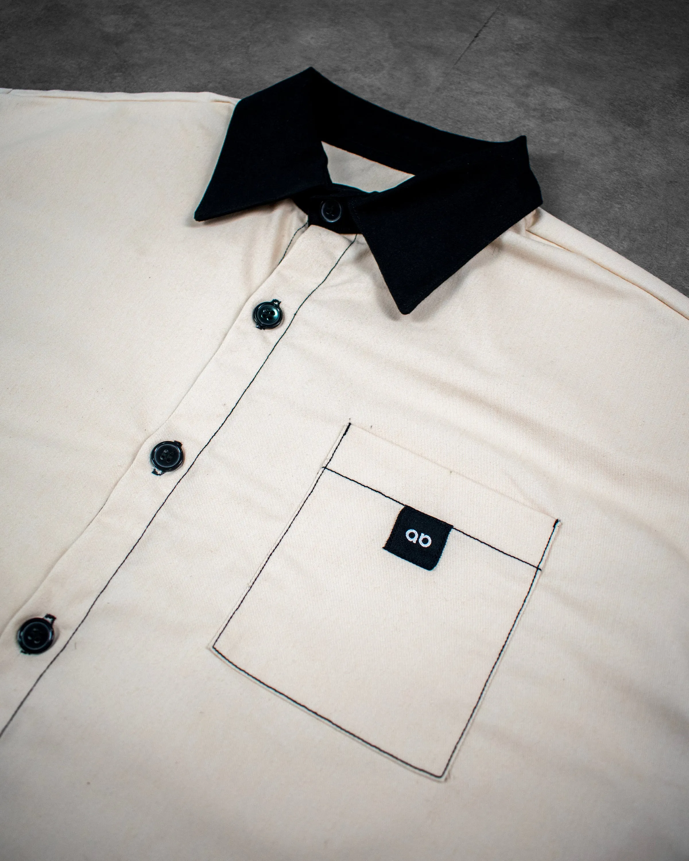 cropped polo shirt | button-down | drop shoulder | dual-tone and box fit | classic twill | crème