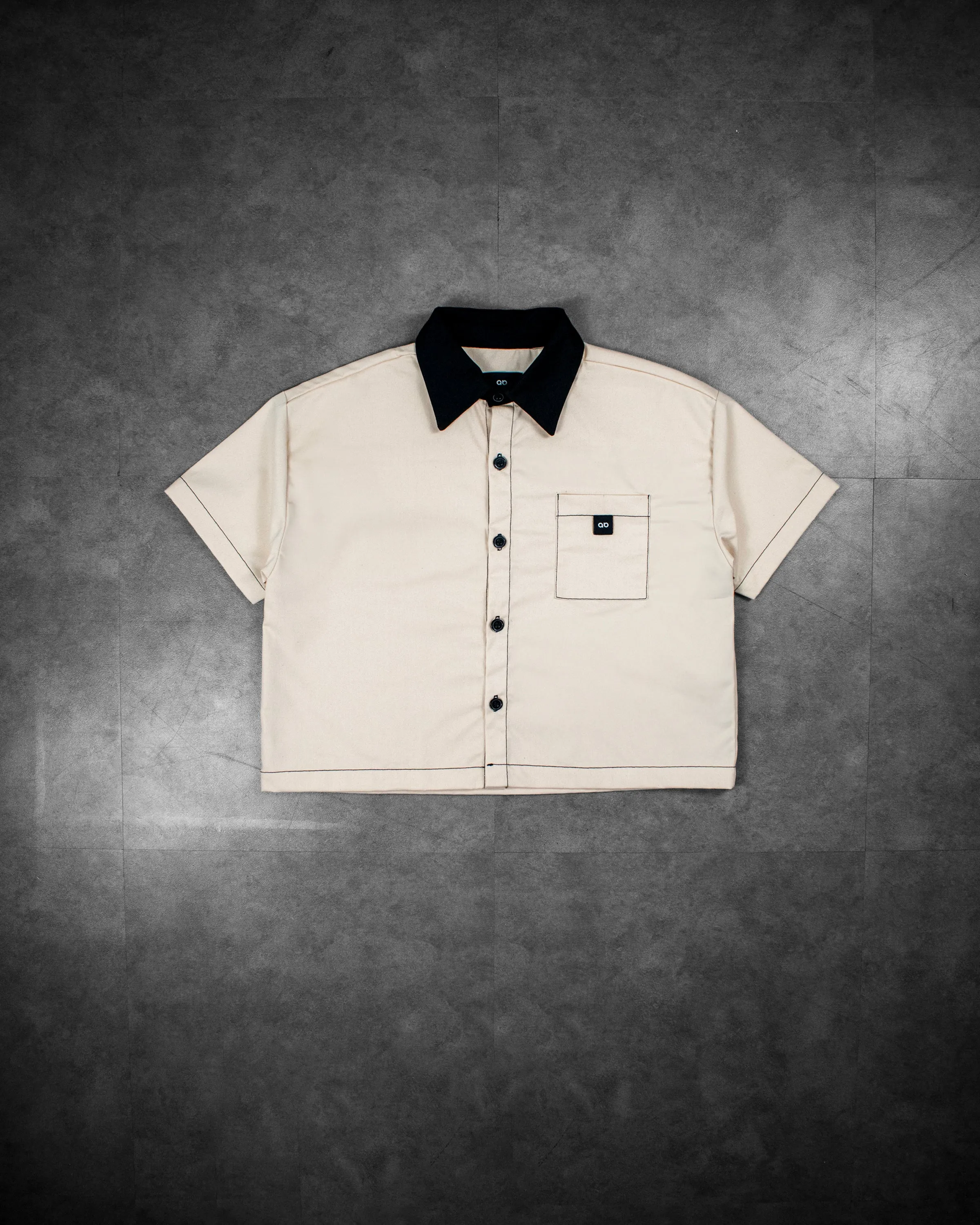 cropped polo shirt | button-down | drop shoulder | dual-tone and box fit | classic twill | crème